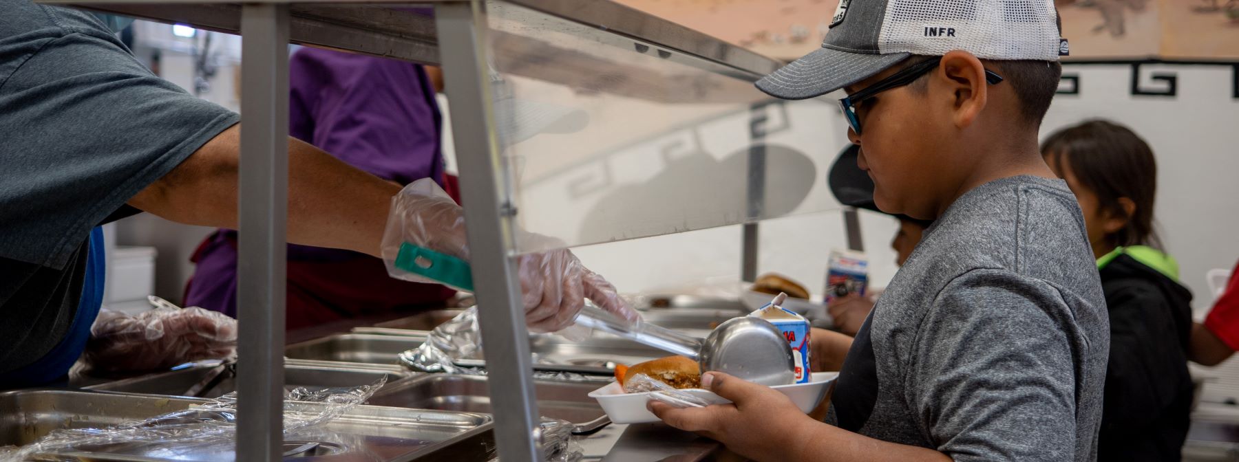 students getting lunch in cafeteria
